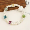Handmade ceramic beaded bracelet featuring colorful glazed beads and a butterfly charm - Colorful Glazed Butterfly (643 Chunchuan)