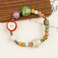 Handmade ceramic beaded bracelet with apple and star charms in colorful vibrant glaze. - Apple Heart and Star (1211-01)