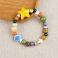 Vibrant Jingdezhen ceramic beaded bracelet featuring yellow star and white cross charms - Xingye Cross Style (1773-01)