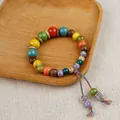 Handmade bohemian style bracelet with colorful ceramic beads and wooden accents - Fortune and Blessing Tassel Style (1773-03)