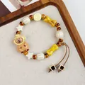 Handmade Jingdezhen ceramic beaded bracelet featuring a cute bear character and star charms - Huhu Bala Bear with Headgear (1798-03)