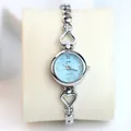 Elegant silver-toned ladies watch featuring a heart-shaped bracelet and a light blue dial - Silver Band Blue Dial