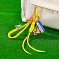 Bright yellow braided rope keychain featuring a soccer ball charm and national flags - Flag Soccer Ball + Yellow Braid Rope + Carabiner