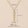Golden heart zircon pendant necklace with copper chain and sizing details - Long Heart Row Zirconia Layered Necklace