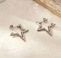 Minimalist stainless steel star shaped hollow hoop earrings with silver metallic finish - Star Studs / Steel Color (MS-595)