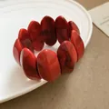 Chic red marbled acrylic oval link bracelet featuring artistic swirled patterns for women - Red