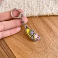 Adorable Banana Cat meme acrylic charm keychain variant featuring a cute cat in a fruit suit - Silver-Pink Bottle Banana Cat