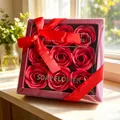 Detailed view of a luxury red soap rose gift box with a satin ribbon bow - Red