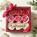 Detail view of a luxury gift box with nine gradient pink and red soap roses. - Red Pink White