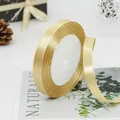 Luxurious 1cm golden satin ribbon for elegant gift wrapping and wedding DIY crafts - Gold