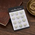 Set of 12 elegant small white pearl flower brooches on a black and white display card - White K Five-Petal Flower Artificial Pearl Style (KZ027-1)