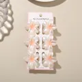 Six pearlescent frangipani flower hair clips on a pink accessories display card - White Pearly Frangipani Style / 6-Piece Set (4cm) / Pearl White Orange / Bulk Packaging