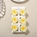 Pack of 6 elegant vintage-style yellow frangipani flower hair claw clips on display - 4cm Heart Petal Style / Set of 6 / Yellow