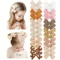 Set of handmade embroidered bow hair clips for kids in various colors and patterns. - Set of 24 Pieces