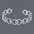 Elegant silver stainless steel open bangle jewelry featuring a hollow heart-shaped design - Hollow Connected Hearts(BS-J5563S)