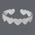 Elegant silver-toned open heart bangle bracelet with intricate textured pattern detailing - Heart Honeycomb Texture(BS-J5565S)