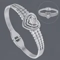Luxurious silver stainless steel bangle bracelet featuring a pavé heart centerpiece - Rhinestone Pave Heart (BS-J5621S)