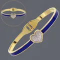 Elegant 18K gold plated stainless steel heart bangle with vibrant blue enamel inlay detail - Blue Heart Enamel (BS-J5645GBLUE)