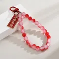 Handmade pink and red beaded keychain charm featuring a Chinese peace blessing tag - Peace and Joy (Red Beads Style)