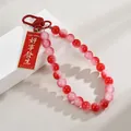 Red and pink frosted beaded phone strap keychain with Good Things Happen metal tag charm - Good Things Happen (Red Beads Style)