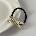 Vintage minimalist gold geometric metal hair tie with textured finish and black elastic band - Double-Layer Cross Design