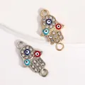 Pair of gold and silver Hamsa hand connector charms with Evil Eye motifs and rhinestones - Three-color Drip Oil Evil Eye Hand