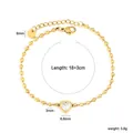 Close-up detail of a gold beaded bracelet featuring a sparkling heart zircon center. - Gold Bead Heart Clear Zircon Bracelet (BR26880AG)