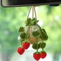 Detailed view of handmade crochet strawberry car mirror hanging plant decoration - Military Green Strawberry