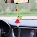 Detailed view of handmade crochet mushroom and frog car mirror hanging ornament. - Frog on Mushroom