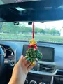 Detailed close-up of a charming hand-knitted Christmas tree car mirror hanging ornament - Christmas Tree Military Green