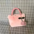 Detailed view of a soft pink faux fur cherry handbag featuring a golden chain strap - Korean Pink / 28*30cm