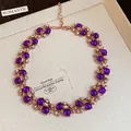 Vintage-style rose gold necklace with round purple beads and crystals. - Gold Purple Beaded Necklace