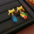 Vintage golden bowknot earrings featuring colorful checkered and blue textured egg charms - Gold Bow Multicolor Irregular Drop Earrings (Silver Earring Post)