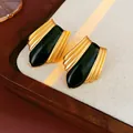 Elegant vintage court style gold ribbed stud earrings with a black enamel center - Gold Black Vintage Earrings (Silver Earring Post)