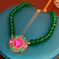 Vintage palace style necklace with green beads and pink crystal pendant in gold finish. - Green Pink Gem Pendant Necklace