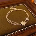 Elegant gold-plated double-layer bracelet featuring iconic pig nose link and star charm - Gold Star Style