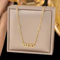 Elegant gold titanium steel necklace featuring a bar pendant with three sliding diamonds - Sliding White Rhinestone Necklaces in Gold Color