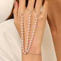 Elegant silver chain hand harness with pink pearl multi-layer finger ring design. - 16 White K 1816