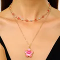Detailed view of elegant double-layered gold necklace with pink flower pendant and crystals - Single-layer Clavicle Chain / Pink (K-833)
