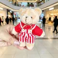 Cute plush teddy bear keychain wearing red striped overalls in a bright mall setting - Male Bear (Red and White Striped) / 11cm