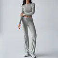 Women's two-piece grey yoga set with long sleeve crop top and flared drawstring pants - XS / Gray