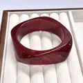 Translucent red resin bangle bracelet with unique curved wavy design in a display box - Geometric Rhombus / Inner Diameter 65mm / Dark Red White Swirl