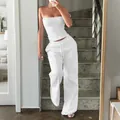 White two-piece set featuring a textured tube top and matching wide-leg drawstring pants - XS / White