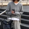 Elegant grey V-neck oversized knitted sweater perfect for a casual chic autumn look - XS / Dark Gray