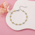 Detail view of a silver daisy charm bracelet with white and yellow enamel petals. - White Daisy (Silver Tone)