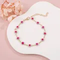 Elegant gold-tone bracelet featuring delicate pink enamel daisy charms for women - Pink Daisy (Gold Tone)