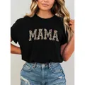 Modisches schwarzes T-Shirt mit MAMA-Buchstaben im Leopardenmuster für einen schicken Look - M / Schwarz