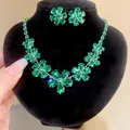 Detailed view of green crystal flower necklace and earring set on black display - Green Flower Water Drop Necklace Earring Set