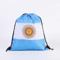 Macro detail of the Sun of May print on an Argentina national flag drawstring bag. - Argentina