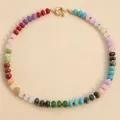 Detailed view of multi-colored natural stone beads on a candy-colored choker necklace - Natural Color